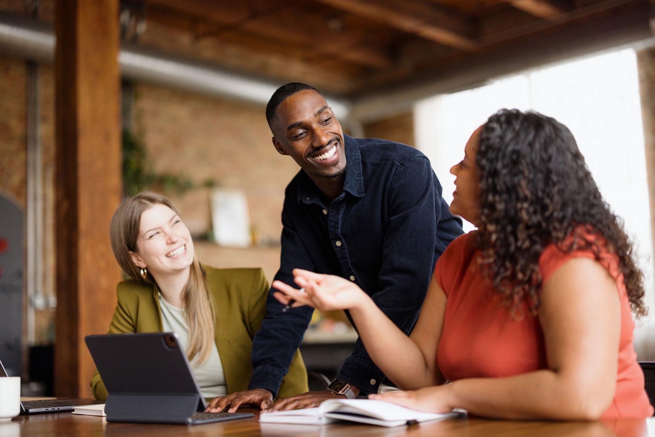 Diverse professionals collaborating in a warm office setting