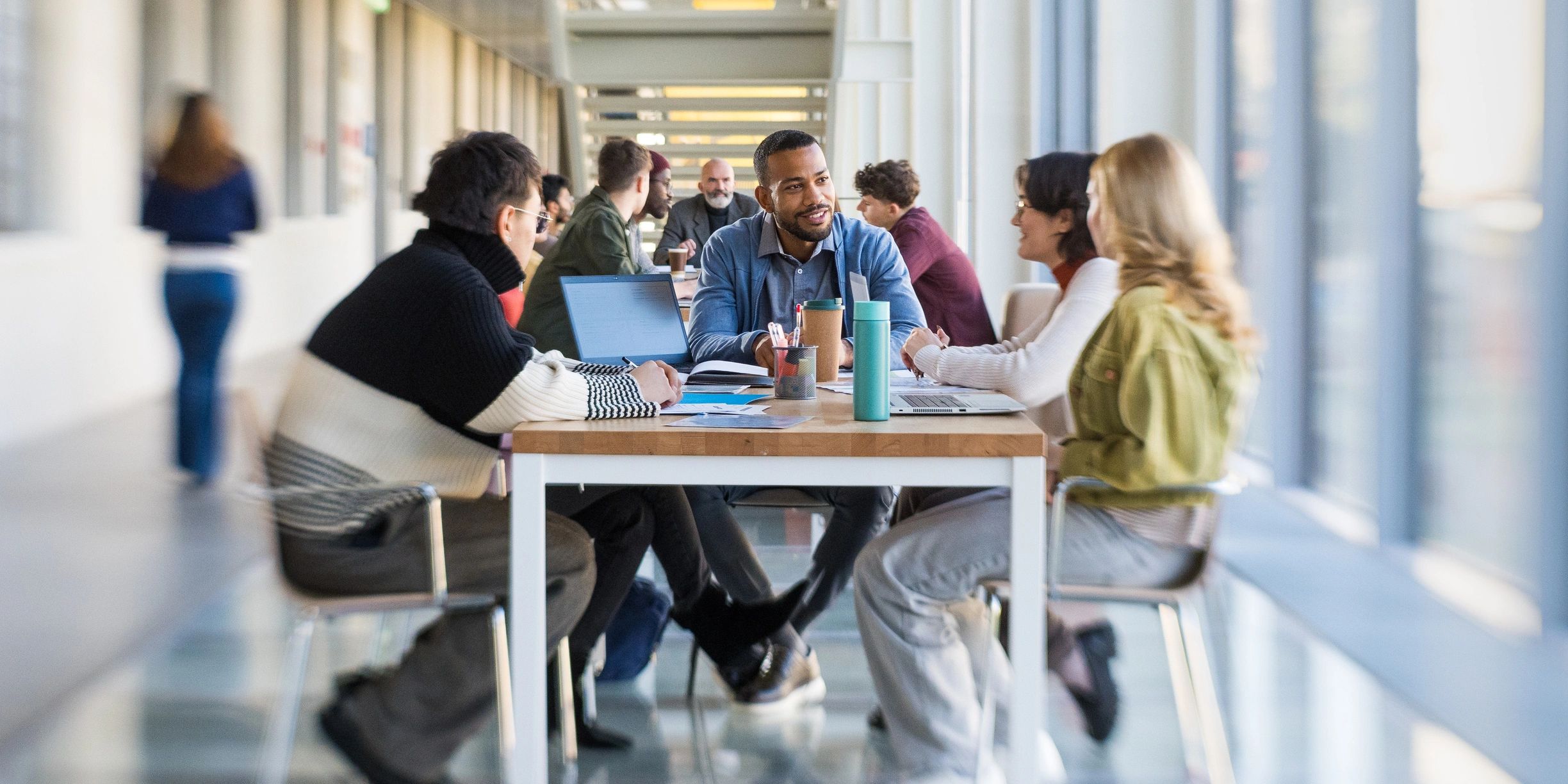 Multicultural entrepreneurs collaborating around a table